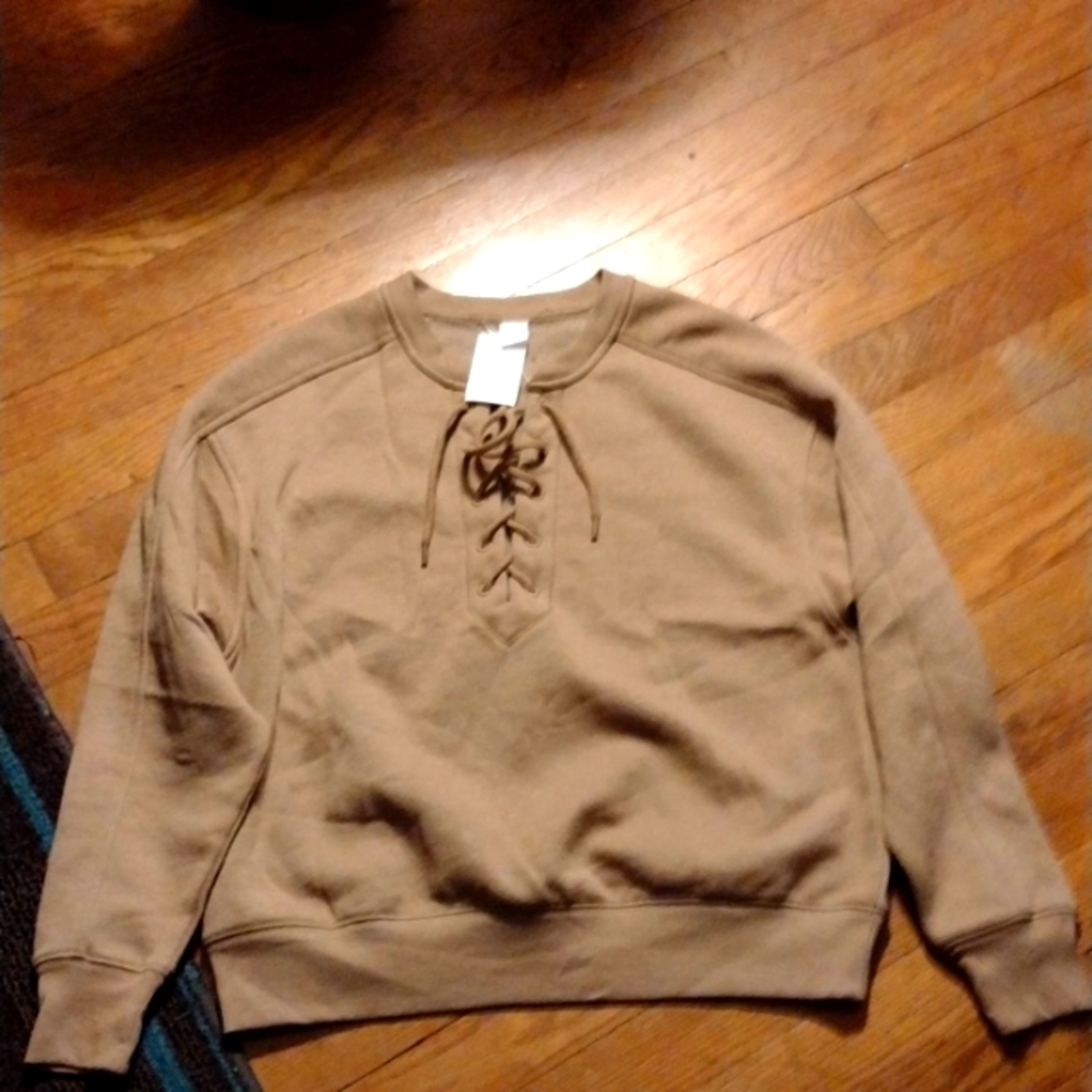 Brown sweatshirt ties in front